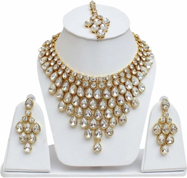 Alloy Jewel SetColor :WhiteColor Code :WhiteModel Number :38nowhiteSales Package Id :1Type :Necklace, Earring & Maang Tikka SetBase Material :AlloyPlating :Gold-plated7 Days Return Policy, No questions asked.