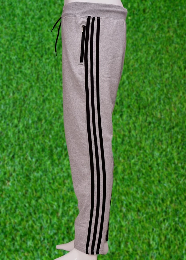 *Human Sparsh Track Pants – Grey Melange*Whether you want to run, relax or sleep, these track pants would be a great choice for you.Grey Colour keeps you relaxed and calm to rejuvenate you for the rest of the time when you’re not wearing it.Design: Solid Colour with Stripes on the sidesPockets: Double Side Pockets with Zip and a Back PocketWaist: It has the elasticated waistband wi - M
