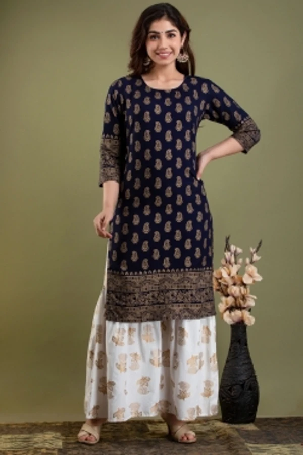 Surhi Women Kurta and Sharara SetViscose Rayon Fabric3/4 SleevePaisley PatternColor: Dark Blue, GoldFor Women10 Days Return Policy, No questions asked. - S