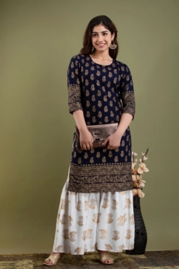 Surhi Women Kurta and Sharara SetViscose Rayon Fabric3/4 SleevePaisley PatternColor: Dark Blue, GoldFor Women10 Days Return Policy, No questions asked. - S