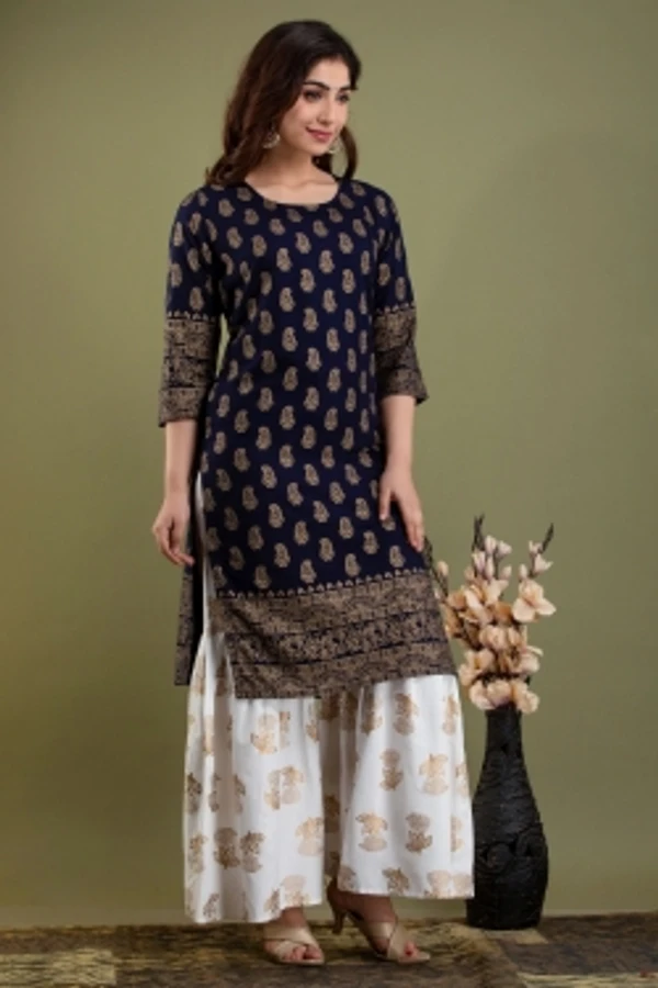 Surhi Women Kurta and Sharara SetViscose Rayon Fabric3/4 SleevePaisley PatternColor: Dark Blue, GoldFor Women10 Days Return Policy, No questions asked. - M