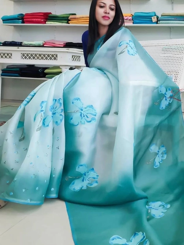 Sky blue digital printed khadi organza saree ! SareeFabric :- Organza Work :- Digital Print Length :- 5.5 mtr BlouseFabric :- Banglori silk Work :- PlainLength :- 0.80 mtr ( unstitched ) - Sky blue