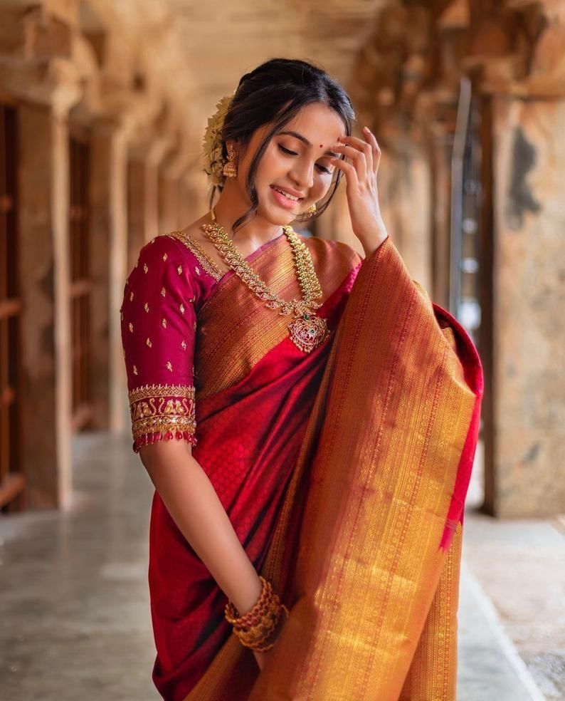 a beautiful indian woman wearing a red sari and gold jewelry. AI-Generated  32557071 Stock Photo at Vecteezy