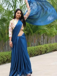 Blue rangoli silk party wear saree with embroidered blouse