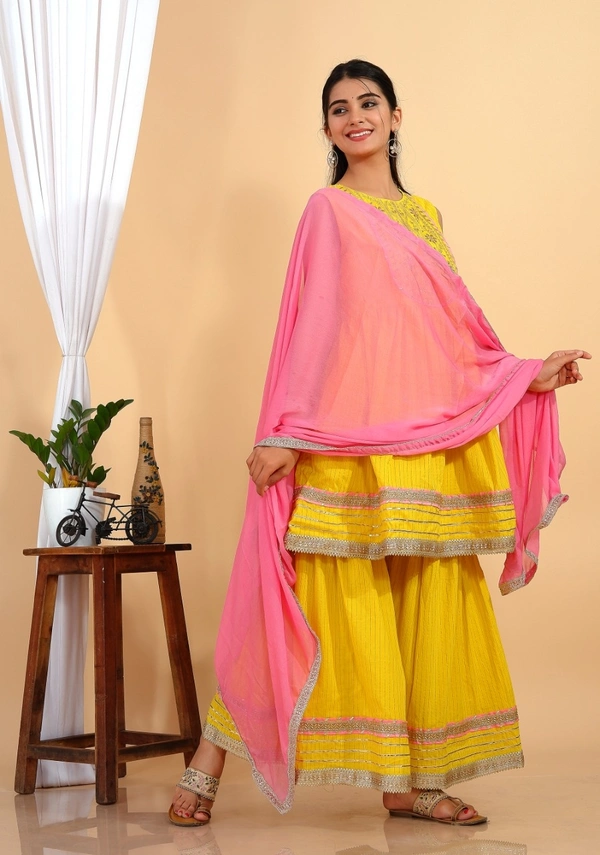 Premium heavy cotton lurex designer tire pattern gown with side slit detailed with heavy gota work all over. - M
