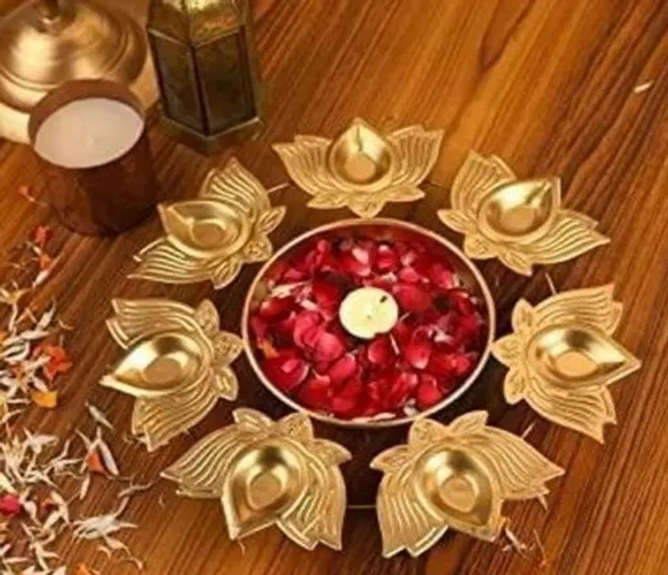 Metal Kamal Lotus diya urli Material: Metal Product Breadth: 10 Inch Product Height: 2 Inch Product Length: 10 Inch Net - Free Size