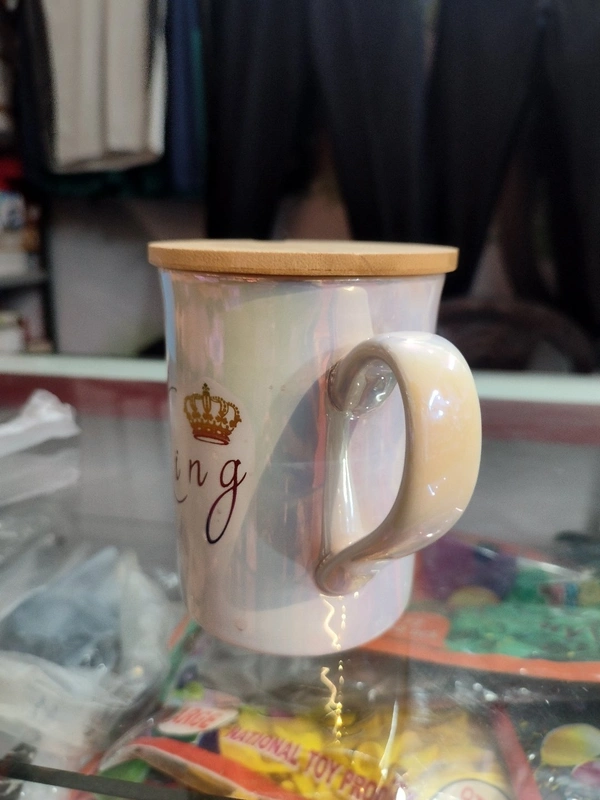 King Mug With Shiny Look And One Spoon And One Wooden Coaster
