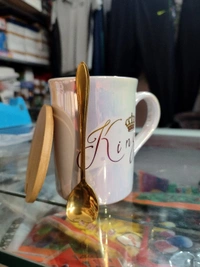 King Mug With Shiny Look And One Spoon And One Wooden Coaster