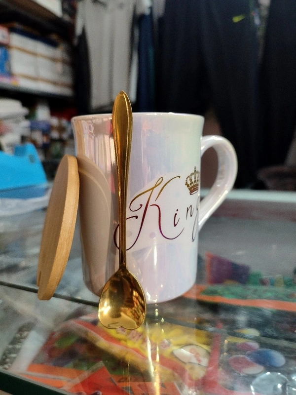 King Mug With Shiny Look And One Spoon And One Wooden Coaster