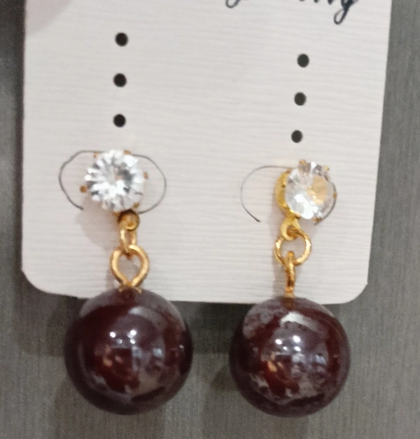Chocolate Ball Earrings With an Elegant Stone