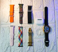 10 Piece Ulta Watch 7+1+1+1 (1 Watch Ultra + 1 Airpods Pro + 1Silicon Case Of Watch Ultra + 7 Straps [10 in1 Set Ultra Smart Bluetooth Calling Smartwatch + Earphones with Transparent Screen Guard Watch with Seven Classic Straps For Smartwatch for MEN & WOMEN Gift Product (1 Set / Mix Color)] - 49 mm, Multicolor