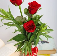 Red Roses In Glass Vase