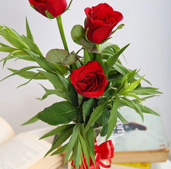 Red Roses In Glass Vase