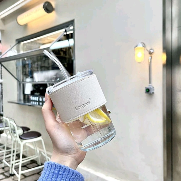 Trending Cute Luxury Transparent Glass Juice Or Coffee Cup With Straw And Leather Finish Holding Grip Support (450ml) 