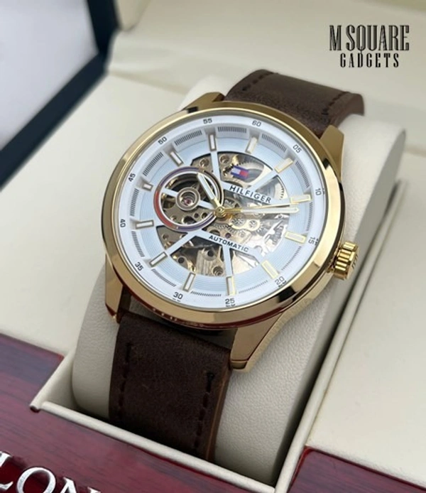 Tommy Hilfiger Modern Machine | Stainless Steel Body with Premium Leather Belt | Golden Dial with Transparent Front & Back | Pendulum Rotate Charging - Fully Automatic Self-wind Machine | Japanese Movement  | Premium Watch | MSquare Gadgets | Luxury Brand