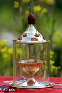 Brass Golden  Akhand Diya - Lamp 4.8 Inch Set Of 2Within 6-8 business days However, to find out an actual date of delivery, please enter your pin code.Heat and Crack Resistant Create a meditative and peaceful ambiance in your puja room with the Heaven Decor Akhand Diya. Even after incessant burning for long hours. It is efficient in emitting brighter light and is safe for use compa