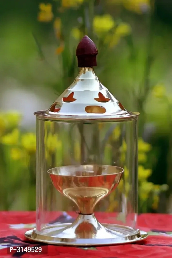 Brass Golden  Akhand Diya - Lamp 4.8 Inch Set Of 2Within 6-8 business days However, to find out an actual date of delivery, please enter your pin code.Heat and Crack Resistant Create a meditative and peaceful ambiance in your puja room with the Heaven Decor Akhand Diya. Even after incessant burning for long hours. It is efficient in emitting brighter light and is safe for use compa