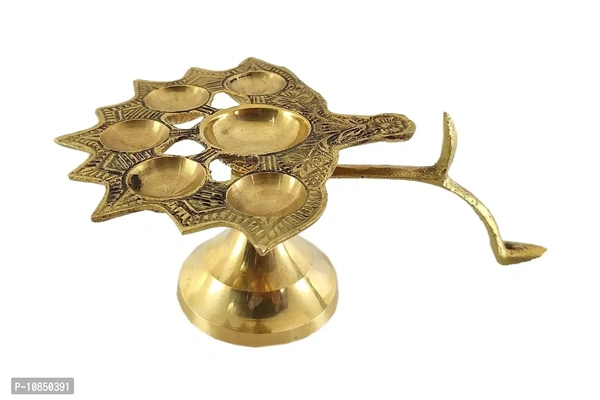 SHREE GANESH ENTERPRISES ? Diya Stand Lamp ? Lamp ? Diya Lamp ? Brass Diya Lamp ? Multi Wick Diya ? Auspicious Diya Lamp for Home Arti ? Praying Diya ? 6 Wick/Batti Lamp. ? Golden Diya LampSize: 12x16x7.5 (l x b x h) cms approxWithin 6-8 business days However, to find out an actual date of delivery, please enter your pin code.• Dimensions: 12X16X7.5 (L X B X H) Cms Approx 4.7x6.2x3