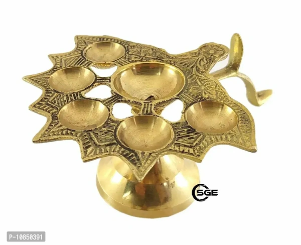 SHREE GANESH ENTERPRISES ? Diya Stand Lamp ? Lamp ? Diya Lamp ? Brass Diya Lamp ? Multi Wick Diya ? Auspicious Diya Lamp for Home Arti ? Praying Diya ? 6 Wick/Batti Lamp. ? Golden Diya LampSize: 12x16x7.5 (l x b x h) cms approxWithin 6-8 business days However, to find out an actual date of delivery, please enter your pin code.• Dimensions: 12X16X7.5 (L X B X H) Cms Approx 4.7x6.2x3