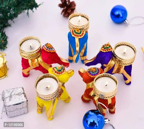 The Click India Tealight Candle Holder for Home Decoration Elephant Candle Holder Candle Tea Light Holder Home Decor Diwali Decoration Items| Diwali Gifts (5 Velvet Elephant tealight)Size: 3 x 3Within 6-8 business days However, to find out an actual date of delivery, please enter your pin code.• Elephant/ Puppet Tealight Candle Holder with its beautiful design and traditional look 