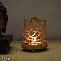 Shadow Ganesh ji  Tealight Candle HolderWithin 6-8 business days However, to find out an actual date of delivery, please enter your pin code.Material: Iron Color: Golden Vibrant and visually appealing, this Ganesh Ji candle tea light holder from the storehouse collection of Heaven Decor exhibits great artisanship. Heaven Decor, a well known brand is known to provide wide range of d