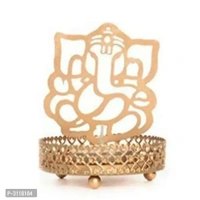 Shadow Ganesh ji  Tealight Candle HolderWithin 6-8 business days However, to find out an actual date of delivery, please enter your pin code.Material: Iron Color: Golden Vibrant and visually appealing, this Ganesh Ji candle tea light holder from the storehouse collection of Heaven Decor exhibits great artisanship. Heaven Decor, a well known brand is known to provide wide range of d