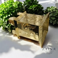 Sold By ZAIN R CREATION A Brass Tulsi Pot, also known as a Tulsi Kyara or Tulsi Maadam - H.7.5'' L.4'' B.5.5'', Brass