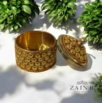 Sold By ZAIN R CREATION A Sindoor or Kumkum pot is a traditional container used to store sacred red powder - H.2'' B.2'', Brass