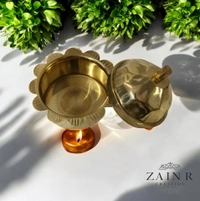 Sold By ZAIN R CREATION A Sindoor or Kumkum pot is a traditional container used to store sacred red powder - H.2'' B.2'', Brass