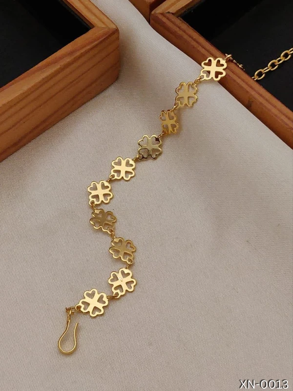 Radiant Blossom Gold-Plated Bracelet: Adjustable Elegance with Four Hearts - Timeless Style for Every Occasion.