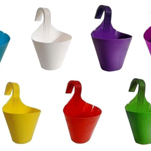 LIFE SPANS   planters
Asian Aura Hanging Planters for Plants Railing Flower Pots, Balcony Railing Vertical Hook for Home Gardening, Unbreakable, (Multicolour, Set of 7)
Material: PlasticTray Included: NoPack: MultipackProduct Length: 10 cmProduct Breadth: 10 cmProduct Height: 10  - Multi color , free
