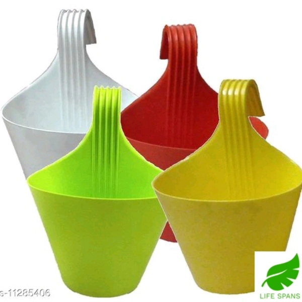 LIFE SPANS   planters
Asian Aura Hanging Planters for Plants Railing Flower Pots, Balcony Railing Vertical Hook for Home Gardening, Unbreakable, (Multicolour, Set of 7)
Material: PlasticTray Included: NoPack: MultipackProduct Length: 10 cmProduct Breadth: 10 cmProduct Height: 10  - Multi color , free