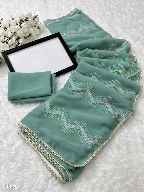 Catalog Name: *Heavy Chifon Georgette Fabric With All Over Sequence Work And Pari Designer Lace Border*

*SAREES FABRIC*:-Heavy Chifon Georgette fabric with all over sequence work and pari  designer lace border*

*Blouse*:-Running blouse

Length:-5.50 MTR sarees and 0.80 mtrblouse*

*Design your Desire*

Brand Name: *Lilu Ethnics*

 - Free