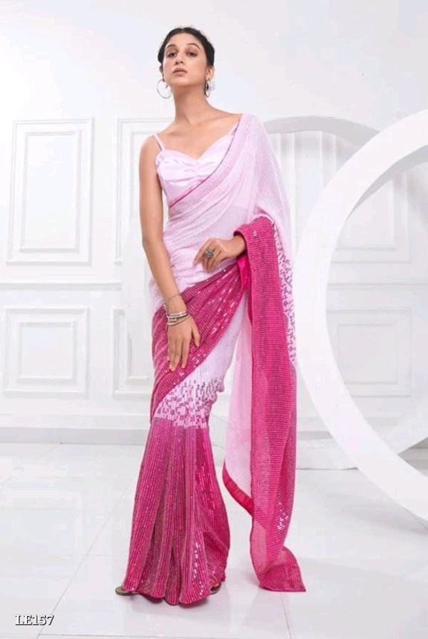 Catalog Name: *Bollywood Style Heavy Sequence Work Saree*

SAREES FABRIC.:-
Georgette with dual shade peding

*Blouse :- satin silk

Work:-5 Mm 3 Mm dual Seqwance work with  support Lace border with piping

Length5.50 MTR sarees and 0.80 MTR blouse

*Design your Desire*

Brand Name: *Lilu Ethnics*

_*Free Shipping! COD Available! Returns Available!*_
 - Free