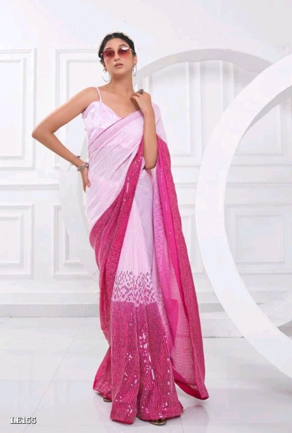 Catalog Name: *Bollywood Style Heavy Sequence Work Saree*

SAREES FABRIC.:-
Georgette with dual shade peding

*Blouse :- satin silk

Work:-5 Mm 3 Mm dual Seqwance work with  support Lace border with piping

Length5.50 MTR sarees and 0.80 MTR blouse

*Design your Desire*

Brand Name: *Lilu Ethnics*

_*Free Shipping! COD Available! Returns Available!*_
 - Free