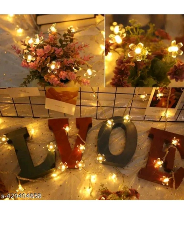 USD$9  Ujjwanix Enterprises Flower String Light| 14 LED 3 M Silicone Light| LED Decoration Light| Warm White Light for Home, Garden, Party, Diwali  rb.gy/fe0fjh
