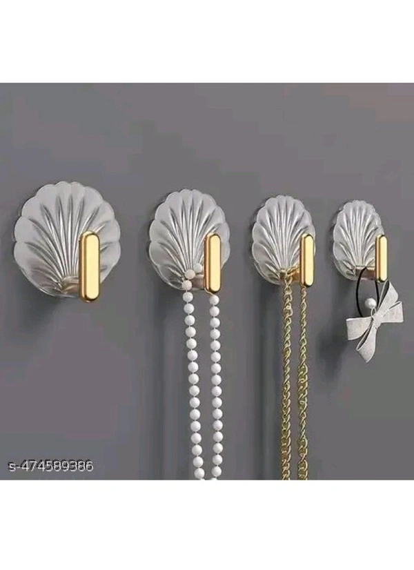ZA0074 USD $ 10.00 Dwija Enterprise Name: Shell-Shaped Creative Self-Adhesive Hooks – Multifunctional Sticky Wall Hooks for Easy Installation in Kitchen, Bathroom, Office, and Home – No Drilling, Strong Hold, Space-Saving, Stylish Design (Pack of 4) rb.gy/wx1b3f