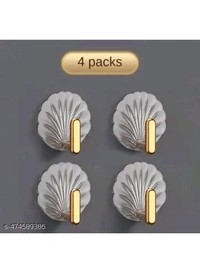 ZA0074 USD $ 10.00 Dwija Enterprise Name: Shell-Shaped Creative Self-Adhesive Hooks – Multifunctional Sticky Wall Hooks for Easy Installation in Kitchen, Bathroom, Office, and Home – No Drilling, Strong Hold, Space-Saving, Stylish Design (Pack of 4) rb.gy/wx1b3f
