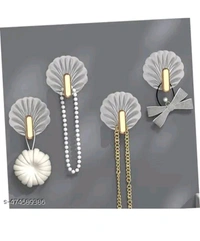 ZA0074 USD $ 10.00 Dwija Enterprise Name: Shell-Shaped Creative Self-Adhesive Hooks – Multifunctional Sticky Wall Hooks for Easy Installation in Kitchen, Bathroom, Office, and Home – No Drilling, Strong Hold, Space-Saving, Stylish Design (Pack of 4) rb.gy/wx1b3f
