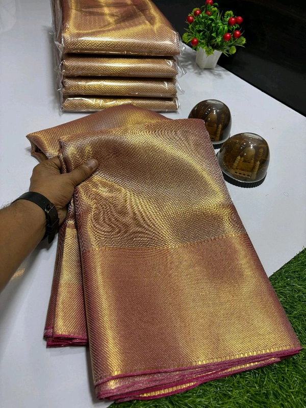 B11001 Trending Jothika tissue silk sarees with rich zari border and pallu