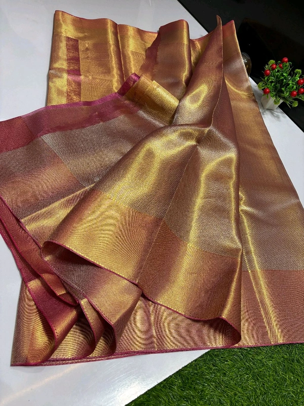 B11001 Trending Jothika tissue silk sarees with rich zari border and pallu