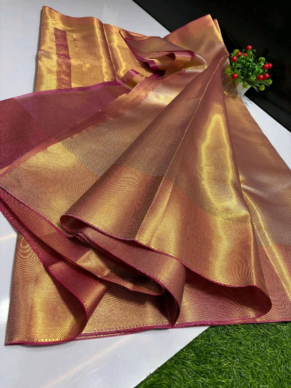 B11001 Trending Jothika tissue silk sarees with rich zari border and pallu