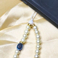 Customized Evil Eye Premium Quality Beaded Phone Charm, Off-White and Golden Beads, 2 Evil Eye Charms, Letter Charms, Stylish Accessory, Lightweight, Durable