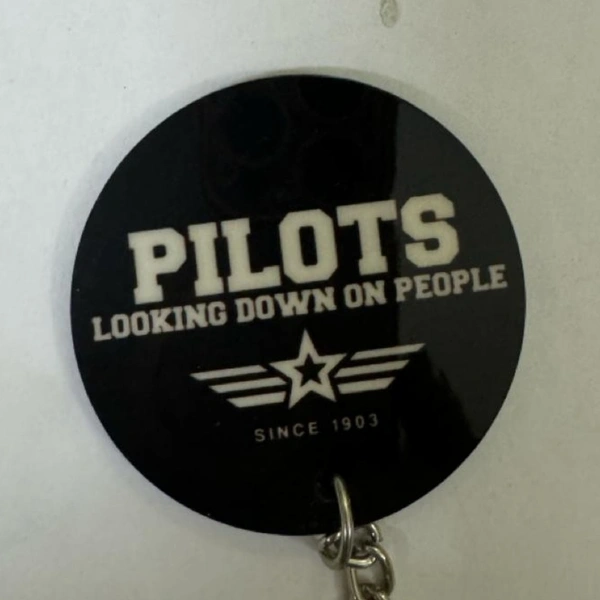 PILOT LOOKING DOWN AT PEOPLE 