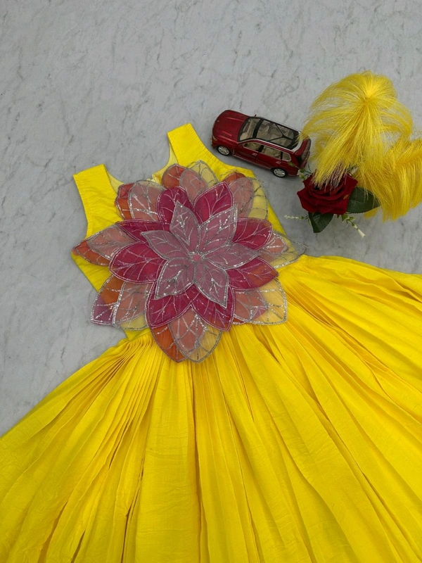 *👗Frock👗*
*Fabric:-* Parampara Silk
*Work:-* Fancy Flowers Cutting Pasting Work - Xl To Xxl Margin