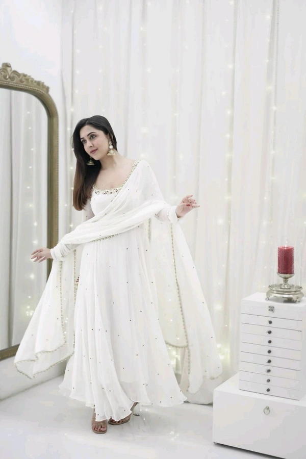 Looking for this same colour beautiful Designer Anarkali on Faux Georgette With Hand work and Pent on Crep febric and Dupatta on also Faux Georgette febri With hand work & Facy Lace. - Xl