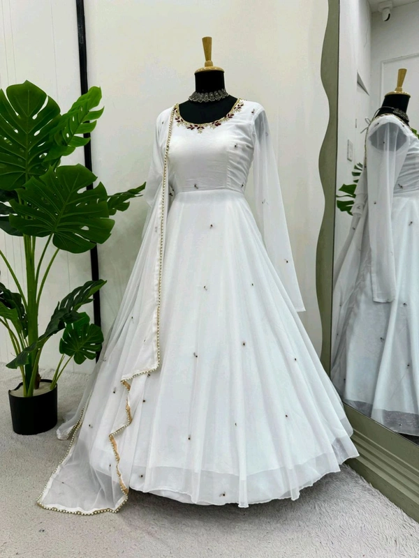 Looking for this same colour beautiful Designer Anarkali on Faux Georgette With Hand work and Pent on Crep febric and Dupatta on also Faux Georgette febri With hand work & Facy Lace. - Xl