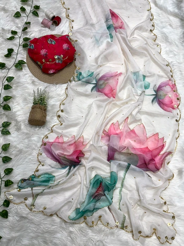 *Pure soft teby silk saree with beautiful digital prints flower nd hand cutdana work heavy outing border in all over saree ,paired with digital fabric with khatli sleeves pattern blouse*
