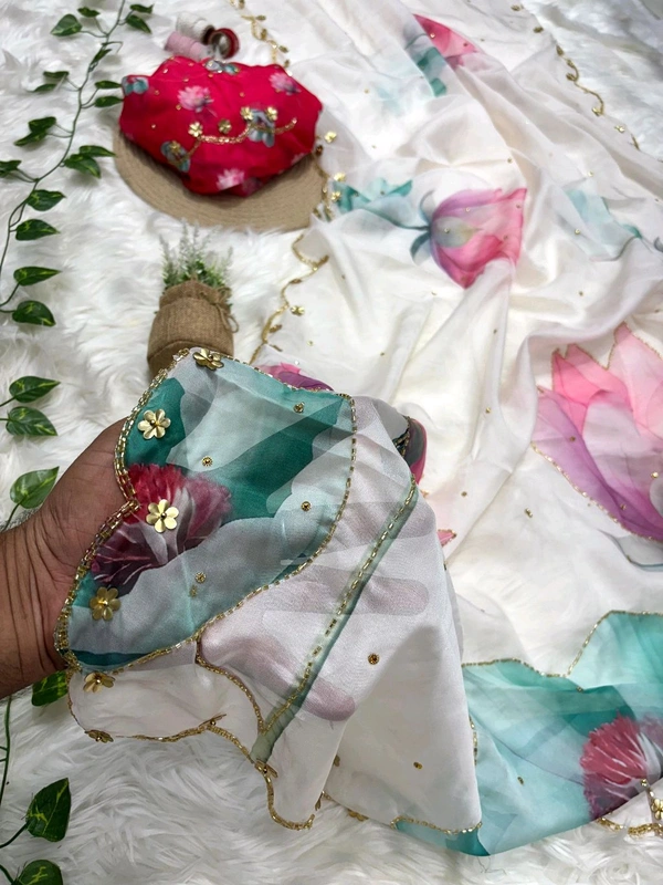 *Pure soft teby silk saree with beautiful digital prints flower nd hand cutdana work heavy outing border in all over saree ,paired with digital fabric with khatli sleeves pattern blouse*