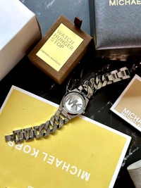 ✅ *Perfectly made for outgoing and active ladies, this Michael Kors modern and stylish watch would be a great accessory for you.* ✅